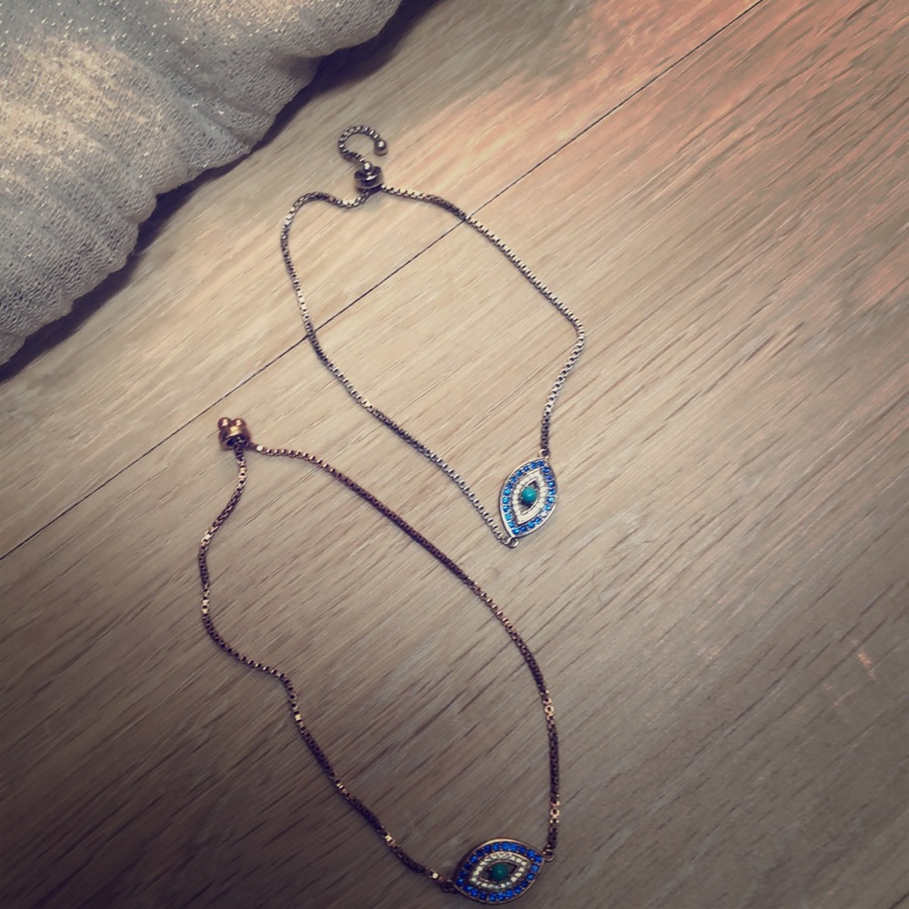Delicate silver and gold eye bracelets